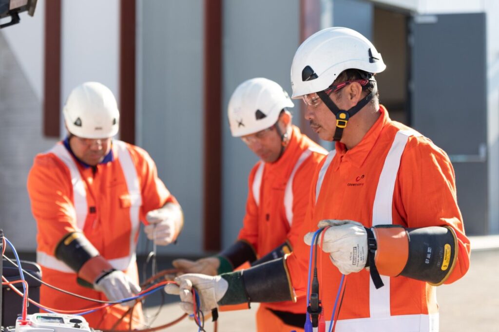 staff working with electrical wires safely