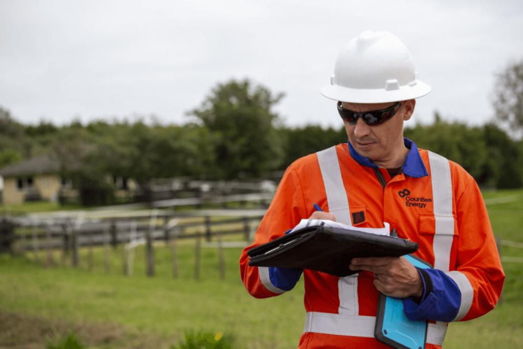 Electrical inspector with notepad.