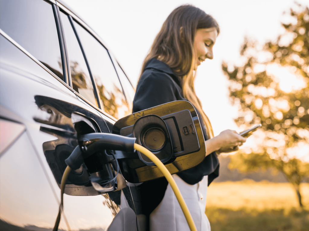 Woman charging her EV car image