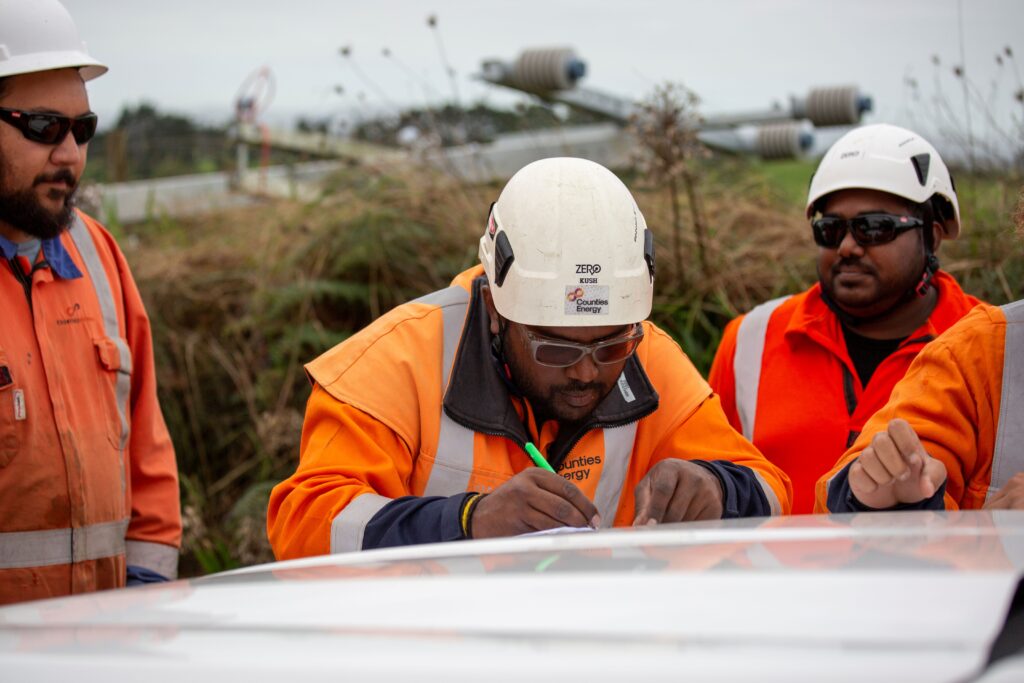 Line crew on site during a debrief.